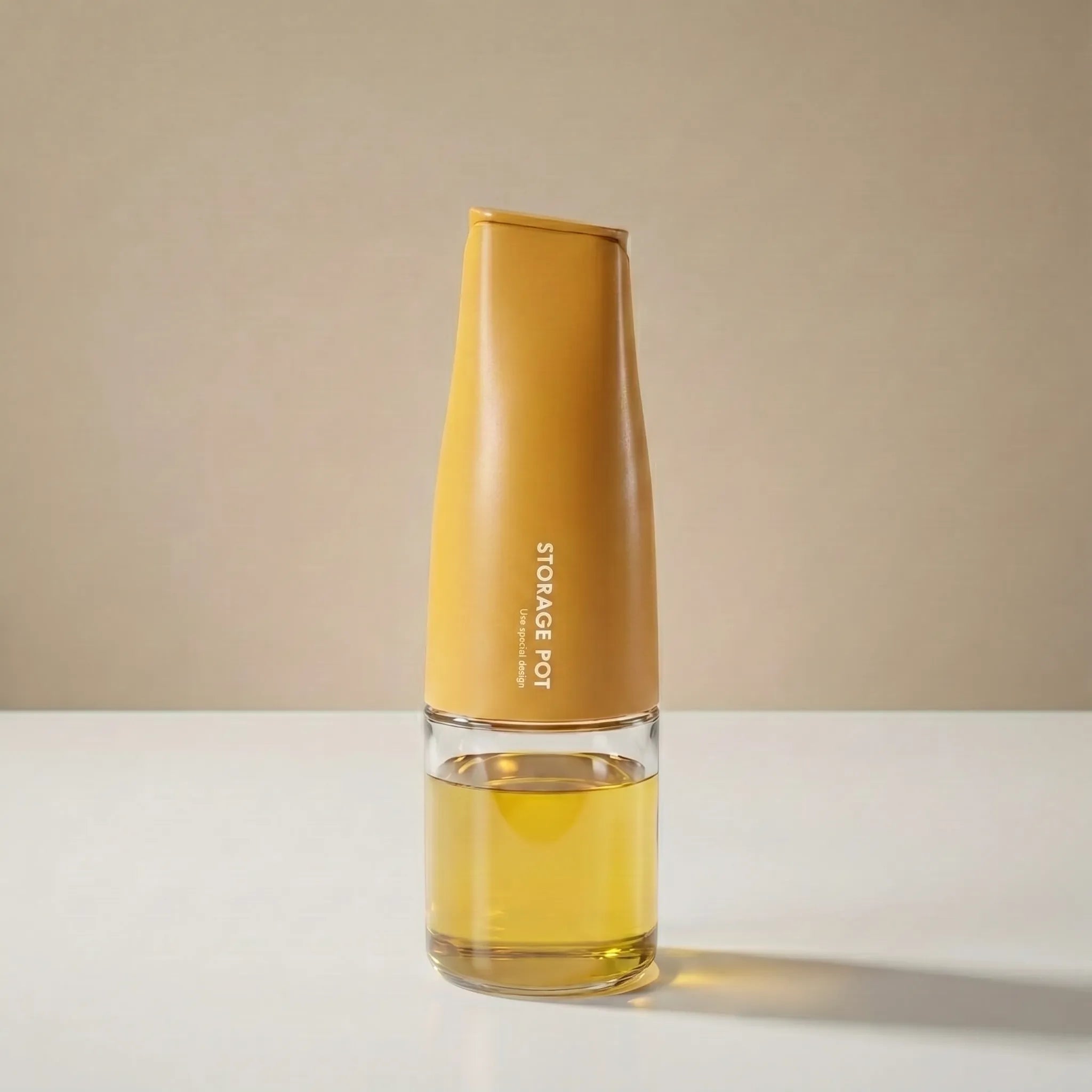 A sophisticated yellow-capped oil bottle for kitchen with an elegant glass and metal construction filled with olive oil