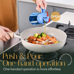 Blue glass cooking oil dispenser bottle pouring olive oil into a wok with seafood and vegetables