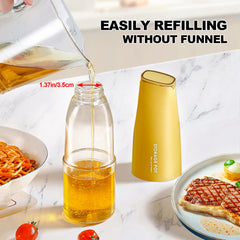 Easily refilling cooking oil into the wide mouth yellow olive oil glass bottle without a funnel