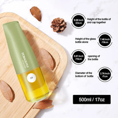 17oz capacity green dispenser oil bottle laid on a wooden board showing product details