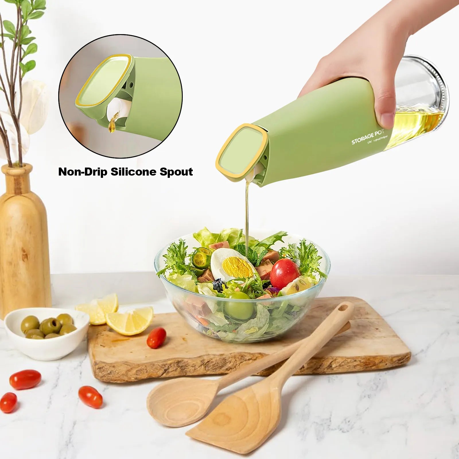 Hand pouring oil over a fresh salad using a green oil dispenser pourer