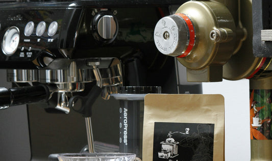 Espresso machine, coffee beans, and grinder in a specialty coffee setup