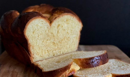 Sliced homemade bread on a cutting board ready for short-term storage