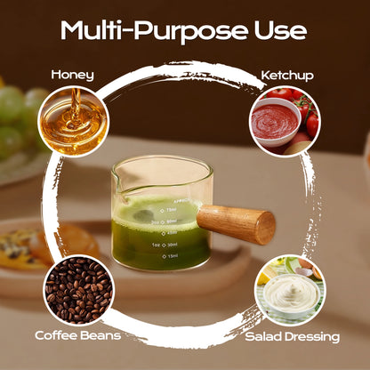 Wooden-handle glass measuring cup with examples of honey, ketchup, coffee beans and salad dressing.