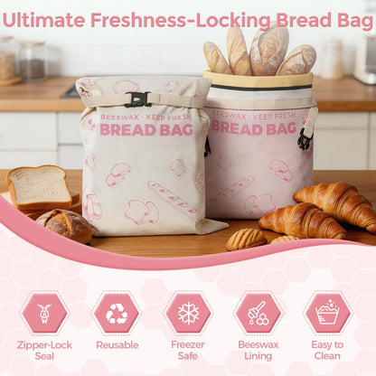 Two reusable beeswax bread bags are displayed on a wooden countertop, one filled with various types of bread, including baguettes and croissants. #Pink