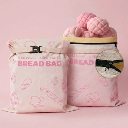 Pink reusable beeswax bread bags with bread pattern for fresh bread and baked goods storage