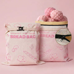 Pink reusable beeswax bread bags with bread pattern for fresh bread and baked goods storage