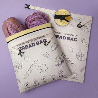 Purple reusable beeswax bread bags with bread pattern for eco-friendly kitchen storage
