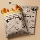 Beige reusable beeswax bread bags with fresh baguettes for keeping bread fresh longer