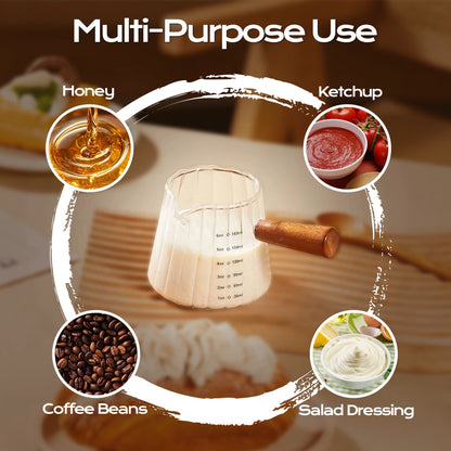 Fluted glass measuring pitcher with a wooden handle, shown with examples of condiments and coffee beans.