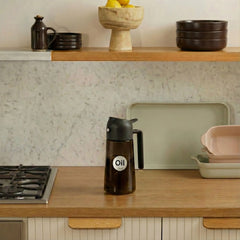 dark brown oil sprayer on the kitchen table