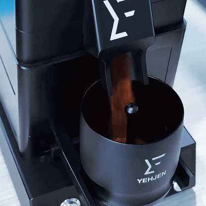 A close-up of a premium espresso machine extracting rich espresso from fresh grounds of a 98mm burr coffee grinder with zero retention