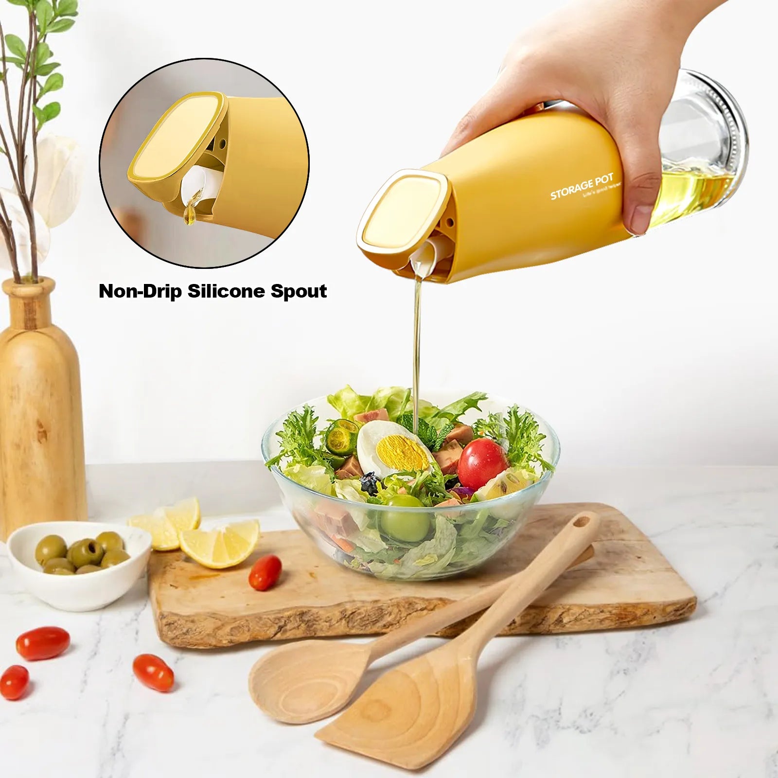 Hand pouring oil over a fresh salad using a yellow oil dispenser pourer