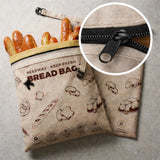 Beige reusable beeswax bread bags with zipper detail for easy bread storage