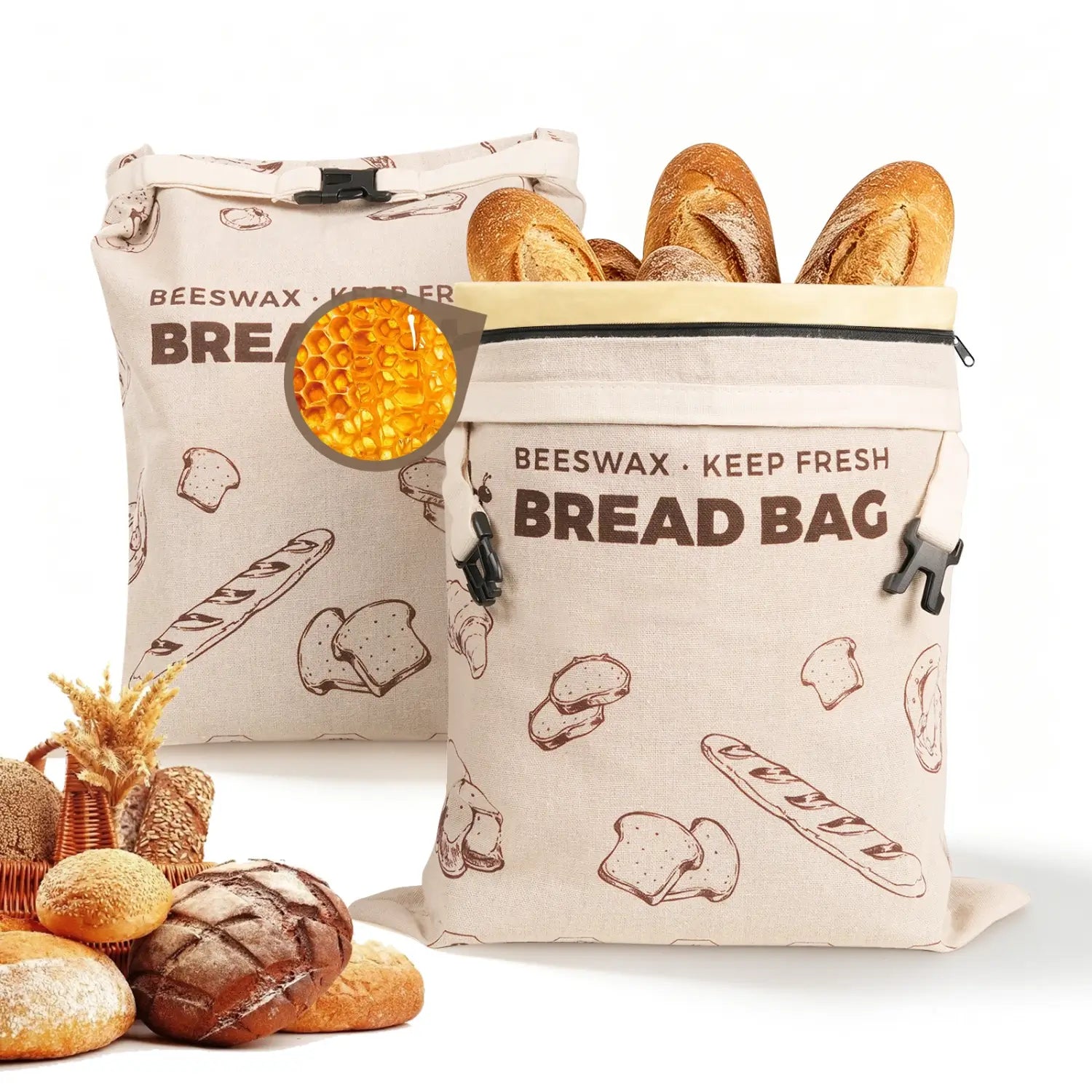 Two reusable beeswax bread bags are displayed, one filled with crusty loaves and the other featuring a design with bread graphics. A piece of honeycomb and assorted baked goods, including rolls and baguettes, are arranged in the foreground #Brown