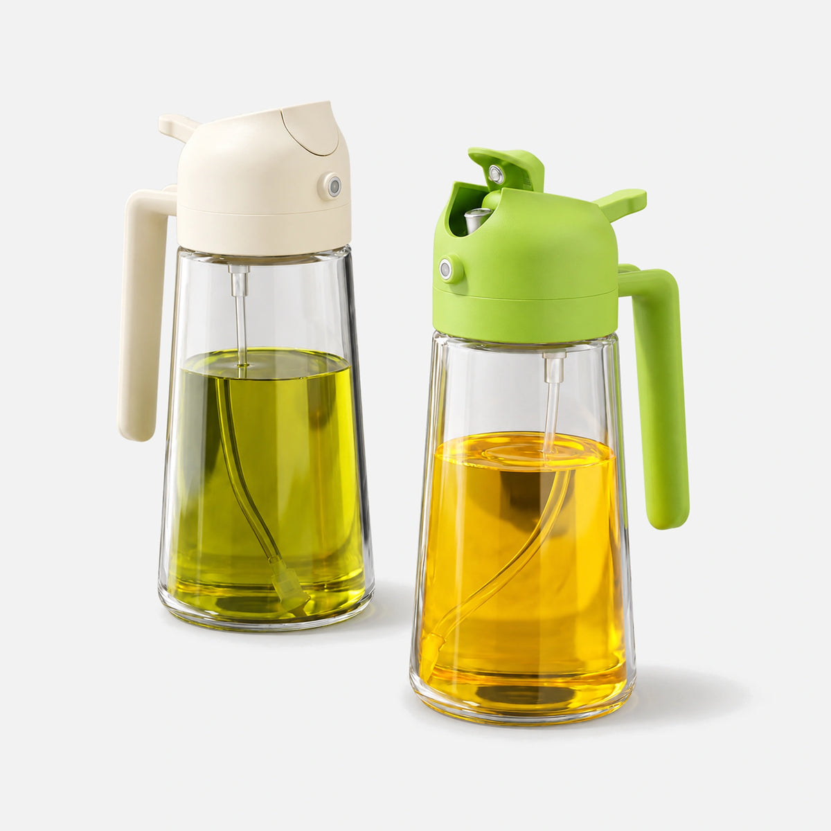 Two glass 2-in-1 oil sprayers with white and green spray heads.