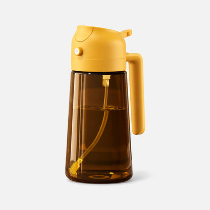 Dark brown glass 2-in-1 oil sprayer with a orange spray head.