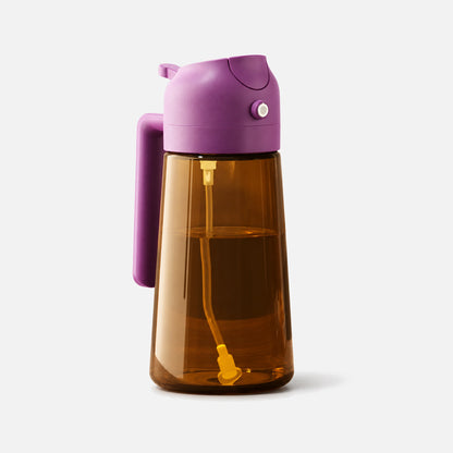 Dark brown glass 2-in-1 oil sprayer with a purple spray head.