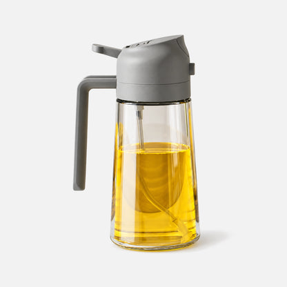 Clear glass 2-in-1 oil sprayer with a grey spray head.