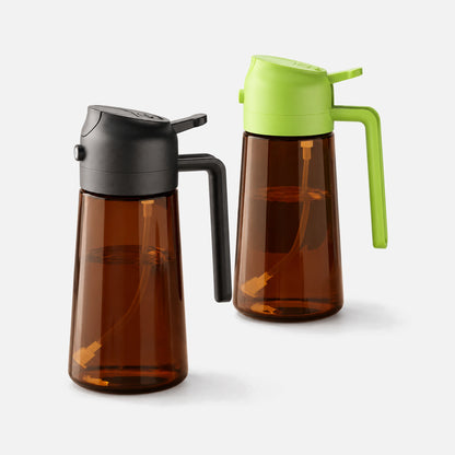 Two dark brown glass oil sprayers with black and green spray heads.