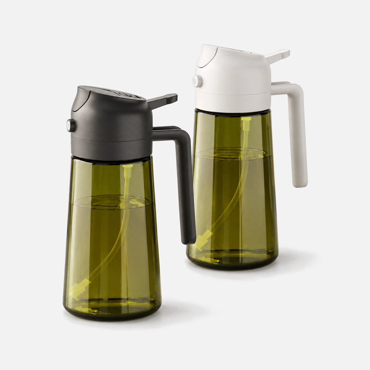 Two dark green glass oil sprayers with black and white spray heads.