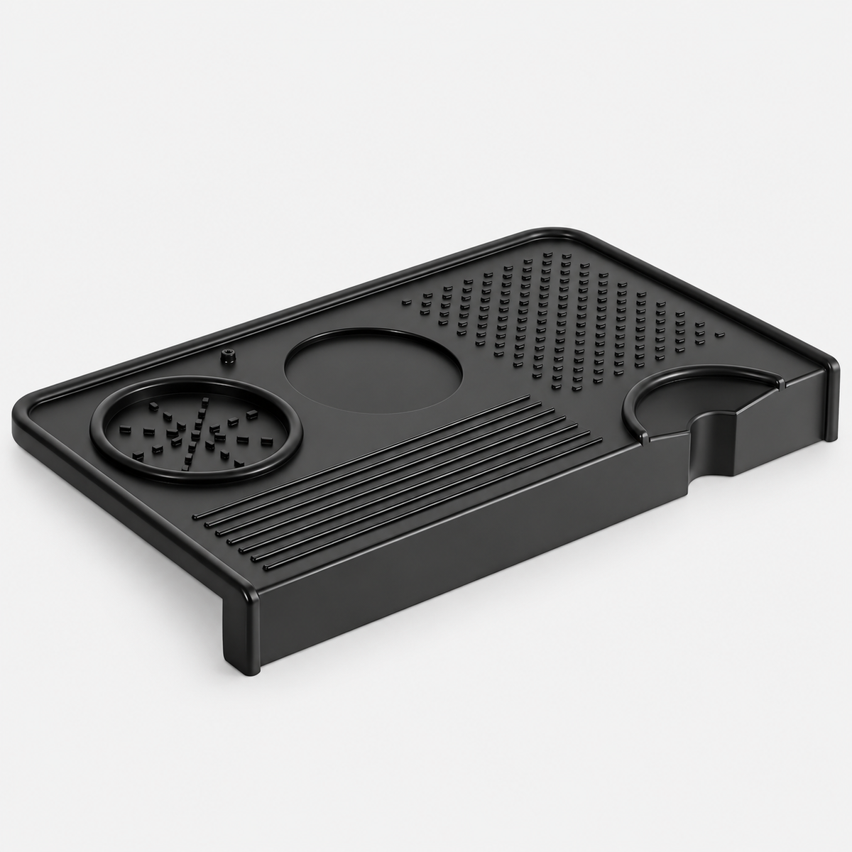 Black silicone coffee tamping mat with a counter edge lip, tool recesses and portafilter cutout.