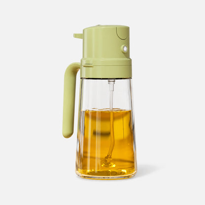 Pulverizador de aceite de vidrio recargable con cabezal y mango verdes.