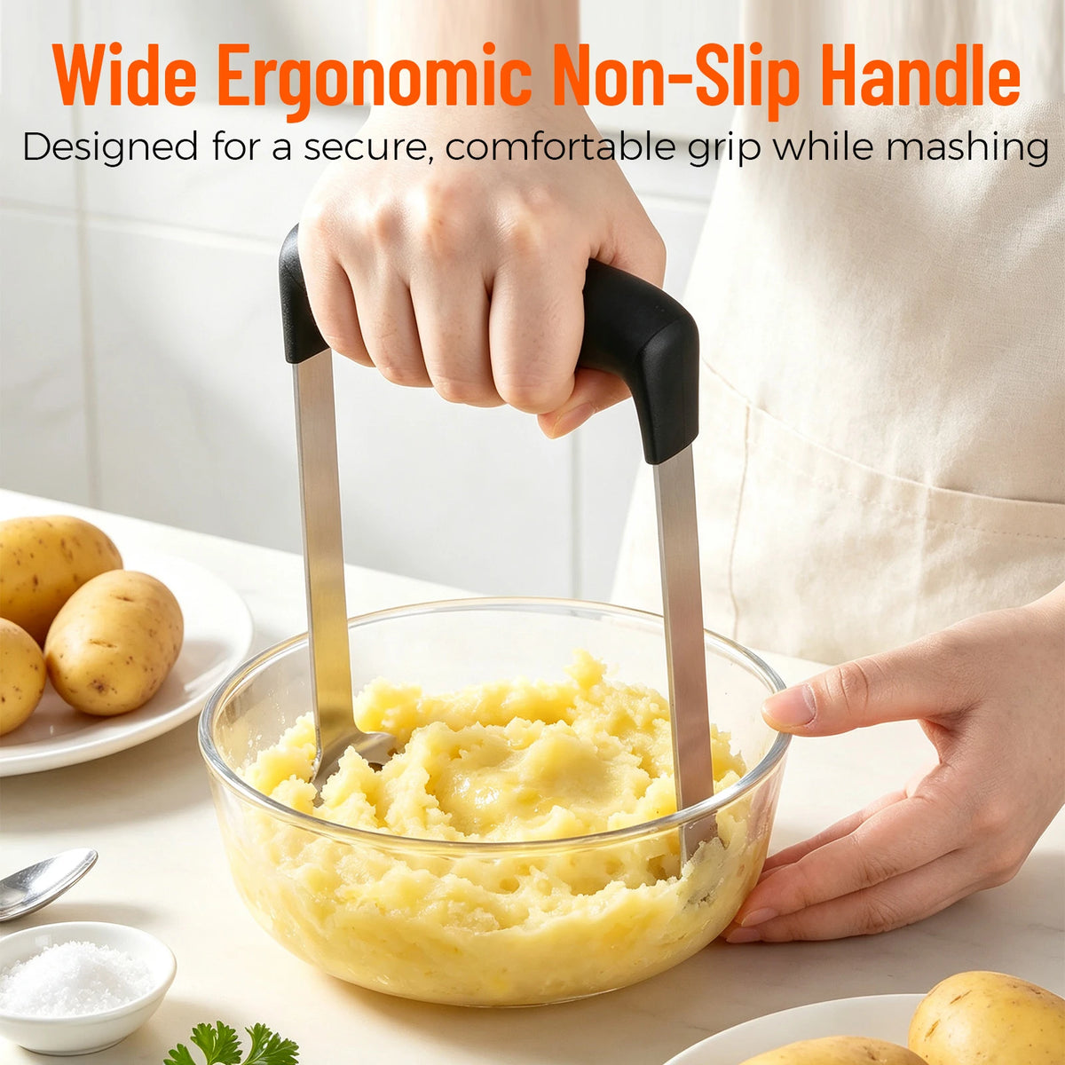 Wide black handle for mashing cooked potatoes