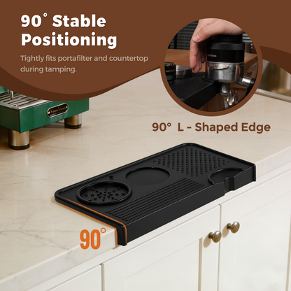 Black silicone mat positioned over a countertop edge for tamping.