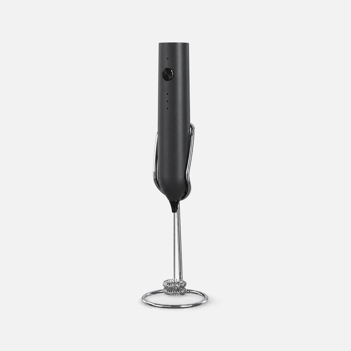 Black rechargeable milk frother with a stand.