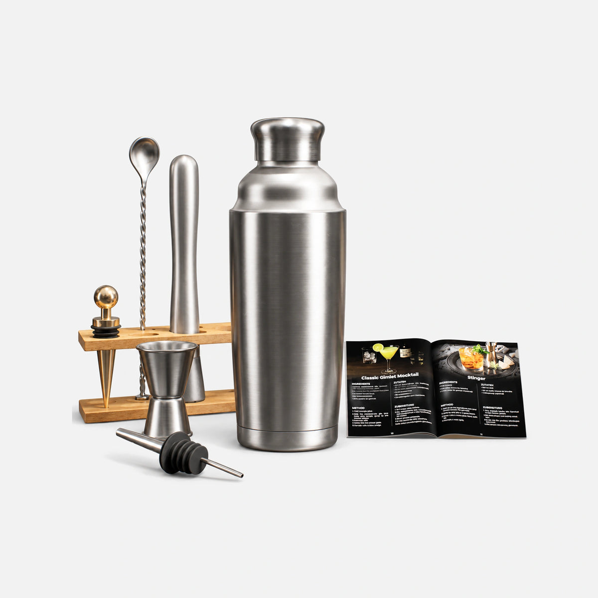 Juego de coctelera de acero inoxidable con accesorios de bar.