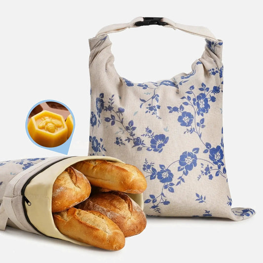 Two blue patterned reusable beeswax bread bags with zippers.
