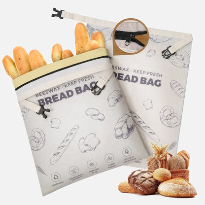 Two purple patterned reusable beeswax bread bags with zippers.